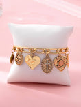 Load image into Gallery viewer, Charm Bracelet, Cross Heart Oval Motifs
